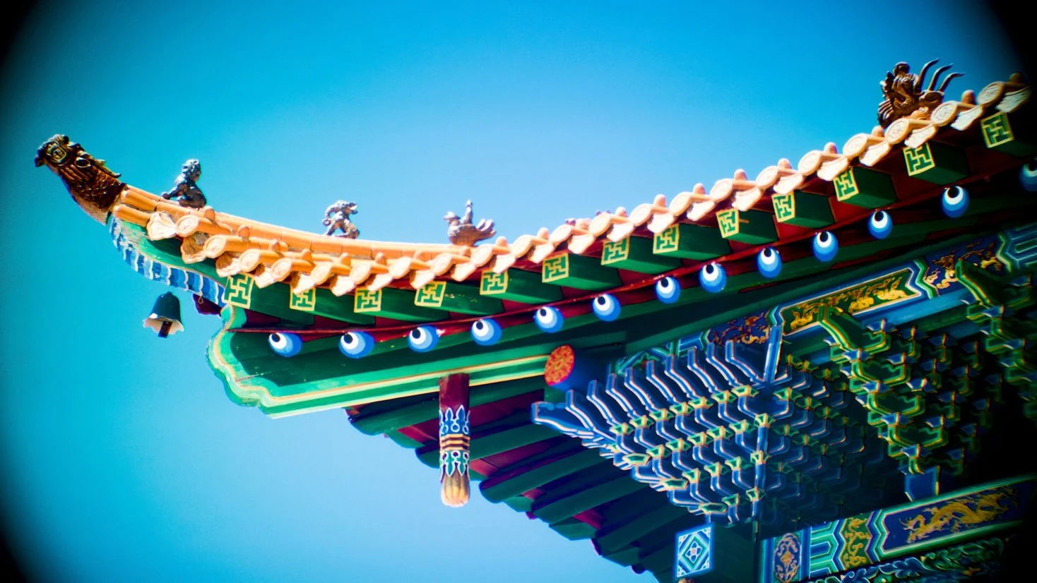Wide-angle photo through Beyond's lenses of a temple scene in VR, lens edges visible in the corners