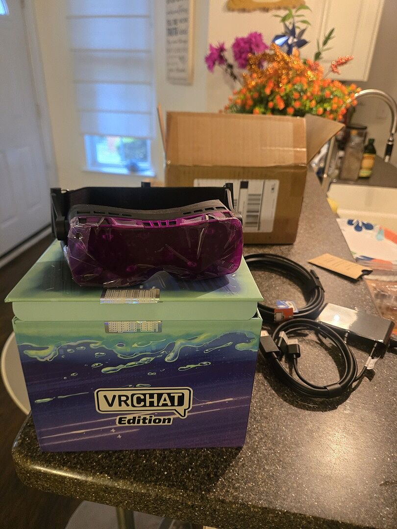 Customer photo: a purple Beyond 2 resting on its VRChat Edition box
